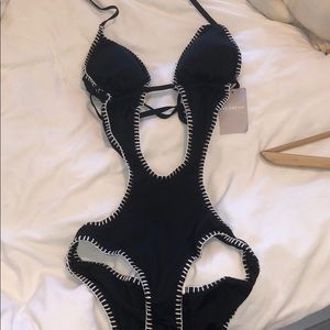 One piece bathing suit with cut outs